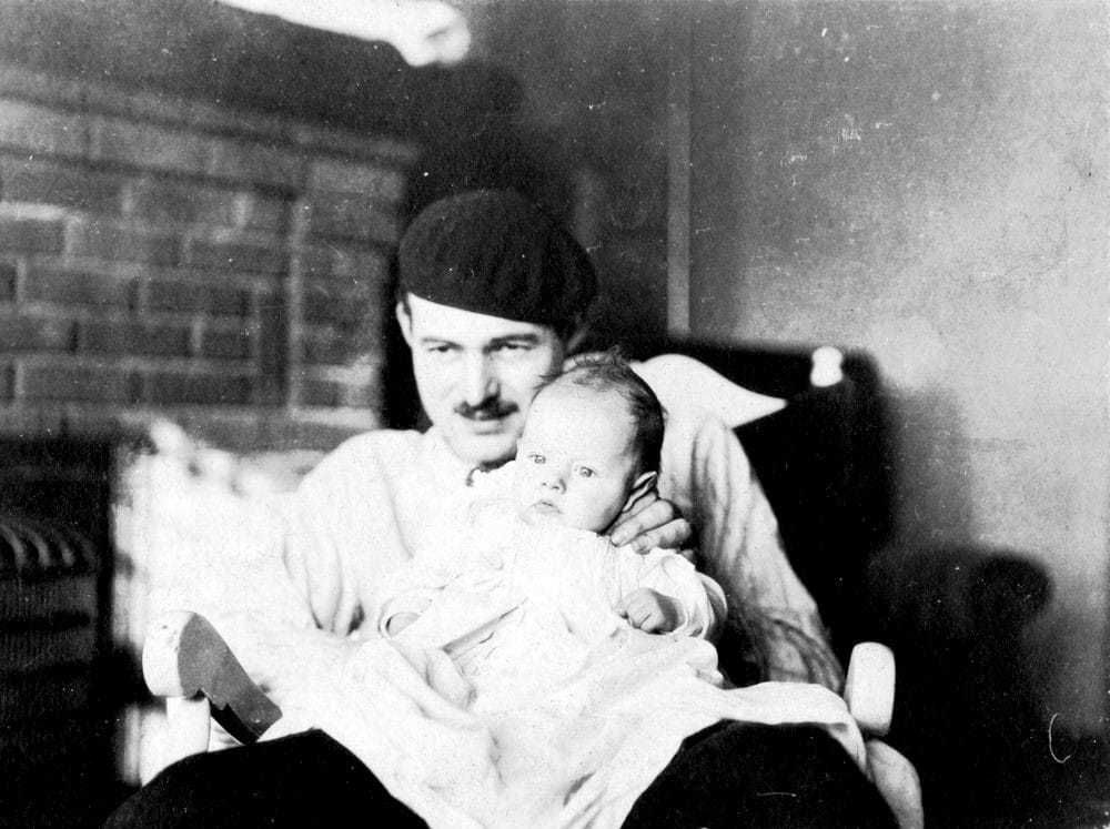 Ernest Hemingway holding Jack as a baby.