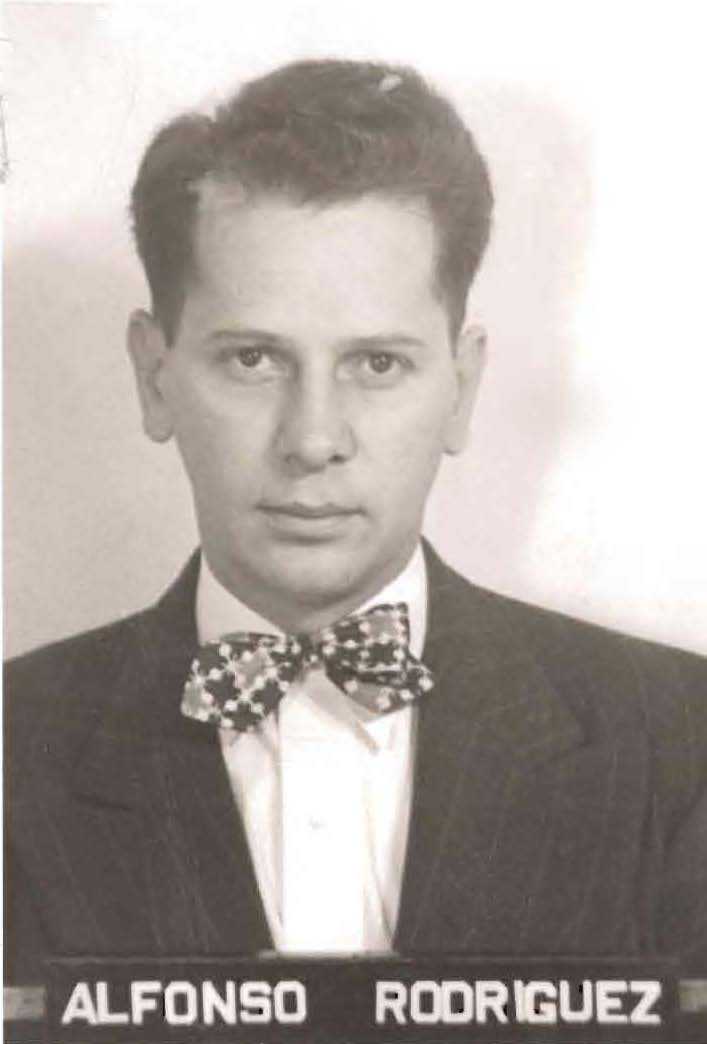 black and white portrait of man wearing a bow tie and suit.