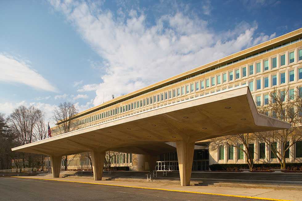 An angled view of the original CIA Headquarters Building during the day.