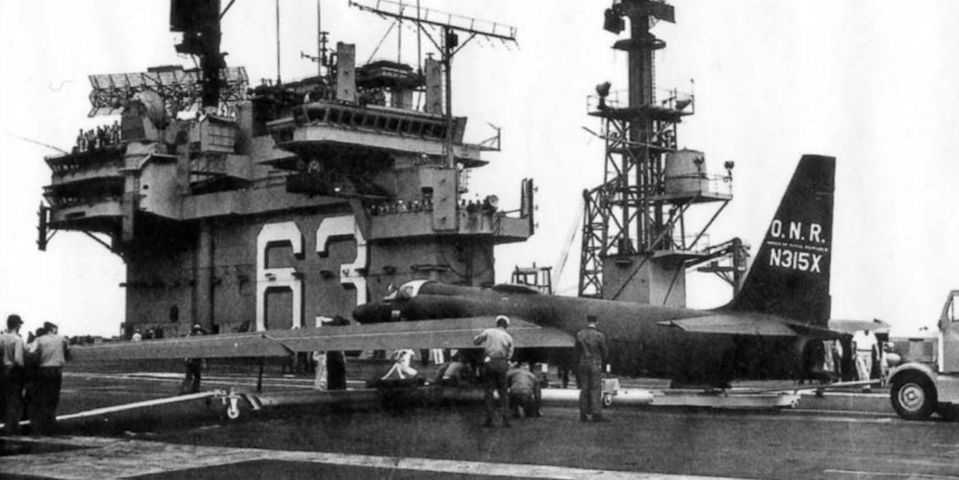 Black and white photo the USS Kitty Hawk.