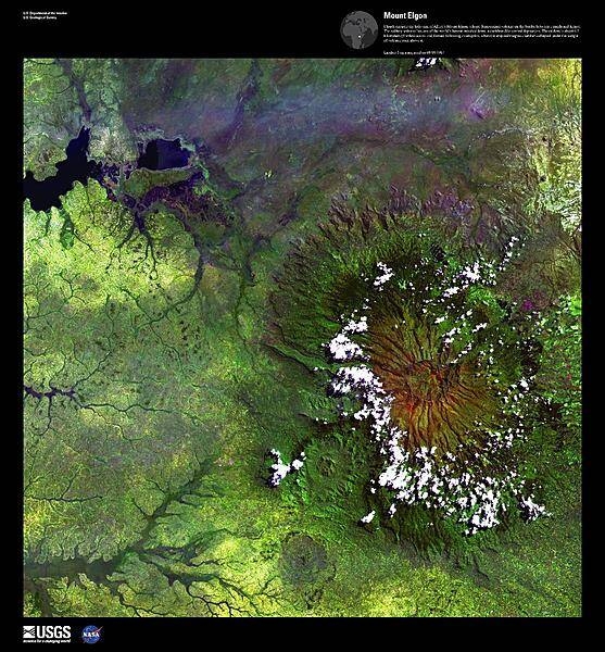 Clouds encircle the lofty rim of Mount Elgon, a huge, long-extinct volcano on the border between Uganda and Kenya, viewed in this enhanced satellite image. The solitary volcano has one of the world's largest intact calderas, a cauldron-like central depression. The caldera is about 6.5 km (4 mi) across and formed following an eruption, when the emptied magma chamber collapsed under the weight of volcanic rock above it. For active volcanoes in Uganda, see the Natural hazards-volcanism subfield in the Geography section. Image courtesy of USGS.