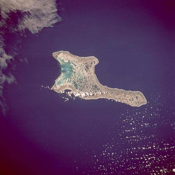 Kiritimati Island (formerly Christmas Island), the largest atoll in the Pacific Ocean, is the centerpiece of this low-oblique, northeast-looking photo. The atoll covers 606 sq km (234 sq mi), of which 243 sq km (94 sq mi) are land. The island was discovered by Captain James Cook in 1777. The majority of the island's inhabitants work on coconut plantations and in copra production. The island's major airbase is on the northeast side of the island. Nuclear tests were conducted on Kiritimati Island by the British in 1957 and 1958 and by the United States in 1962. Image courtesy of NASA.