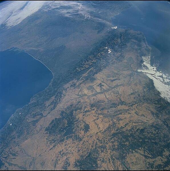 The Pyrenees (whose highest point is Spain's Pico d'Aneto 3,404 m; 11,168 ft) extend from the Bay of Biscay (west, left) to the Gulf of Lyon (east, right). Spain lies south of the range, France is to the north, and Andorra is entirely within the range near the eastern snow patch. There is a long history of mining in the Pyrenees - tin, tungsten, talc, fluorite, barium, and gold. Image courtesy of NASA.