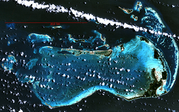 Los Roques archipelago is a federal dependency of Venezuela made up of some 350 islands, cays, and islets in a total area of about 41 sq km. The archipelago is located 128 km (80 mi) directly north of the port of La Guaira. The islands' pristine coral reef attracts visitors from around the world, some of whom come in their own yachts and anchor in the inner, protected shallow waters. Development and tourism are controlled. Because of the wide variety of seabirds and rich aquatic life, the Venezuelan Government declared Los Roques a National Park in 1972. Image courtesy of NASA.