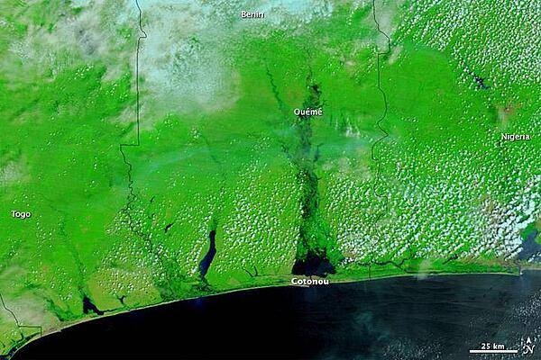 Heavy rains flooded parts of West and Central Africa in the rainy season of 2010, and among the hardest-hit countries was Benin. The image, which shows the coast of Benin on 22 October 2010, uses a combination of infrared and visible light to increase the contrast between water and land. Water ranges in color from electric blue to navy. Vegetation appears bright green. Clouds range in color from off-white to pale blue-green. Photo courtesy of NASA.