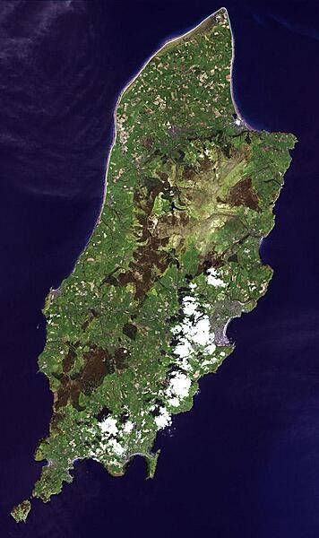 The Isle of Man is a self-governing British Crown Dependency in the Irish Sea between Great Britain and Ireland. The island is not part of the UK, though the head of state is Queen Elizabeth II. Inhabited since 6500 BC, the island was influenced by Gaelic culture, settled by the Norse, was part of Scotland, and came under the feudal overlordship of the English Crown in 1399. The island's parliament, Tynwald, is one of the oldest ruling bodies in the world, possibly dating to the 10th century. The satellite image, acquired 1 May 2001, covers an area of about 30x50 km (19x31 mi). Photo courtesy of NASA.