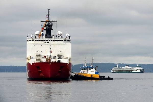 US Coast Guard Cutter Healy (WAGB-20) approaches the pier at Base Seattle on Saturday 20 November 2021