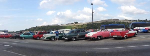 At a Cuban car park. After Castro gained control of the island nation in 1959, a US trade embargo banned the export of American vehicles and parts to Cuba. Since then, Cubans who decided not to buy a poorly made Russian vehicle have used whatever parts they could scrounge to keep their American cars cobbled together and running. Today, Cubans are once again allowed to buy and sell cars, and some European automakers offer new cars for sale in Havana and other Cuban cities. Unfortunately, most Cubans are unable to afford them, so they continue to drive classic cars whether they are in good shape or not. Some 60,000 pre-revolution cars remain on the road.