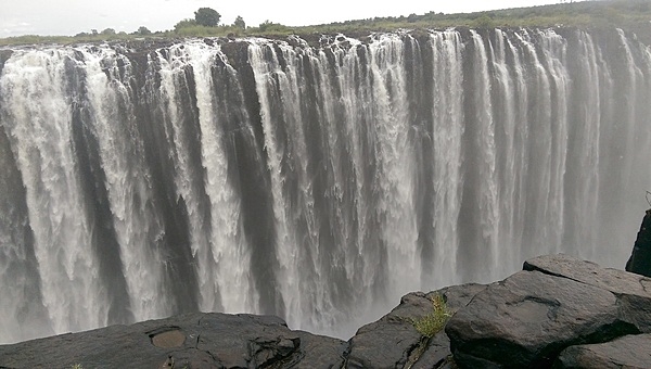 A closer view of Victoria Falls' plunging waters. The falls are located between the borders of Zambia and Zimbabwe.