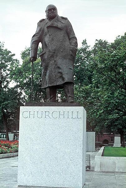 The statue of Winston Churchill on the grounds of the Houses of Parliament building (Westminster Palace) in London, United Kingdom.