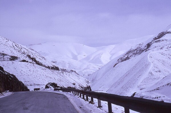 A view of the Elburz Mountains, a narrow mountain range that curves along the southern shore of the Caspian Sea in northern Iran. Trending west to east, the mountain range measures about 970 km in length and forms a climatic barrier between the Caspian and the Central Iranian Plateau.