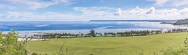 Panoramic view of Asan Bay and part of the War in the Pacific National Historical Park. In July 1944, Asan Bay was the site of  the northern invasion landing area on the west coast of Guam. The 3rd Marine Division landed in this area with an objective of seizing the high ground behind the beach area. Photo courtesy of the US National Park Service.
