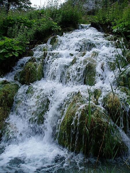 Close up of waterfalls in Plitvice Lakes National Park. The park is the largest and most popular of the eight national parks in Croatia and consists of 16 lakes linked but separated by natural dams.