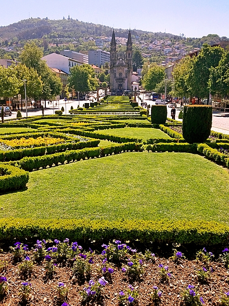 The medieval section of Guimaraes, Portugal, opens onto the Largo Republica do Brasil (Republic Square of Brazil). One end of the square features the slim Nossa Senhora da Consolacao e dos Santos Passos (Church of Our Lady of Consolation and the Holy Steps), an example of Portuguese Baroque architecture.