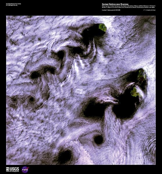 When wind-driven clouds encounter obstacles, in this case islands, they flow around them to form large, spinning eddies known as Karman vortices. The Karman vortices in this high-resolution satellite photo formed over the islands of Broutona, Chirpoy, and Brat Chirpoyev (Chirpoy&apos;s Brother), all part of the Kuril Island chain found between Russia&apos;s Kamchatka Peninsula and Japan. Image courtesy of USGS.
