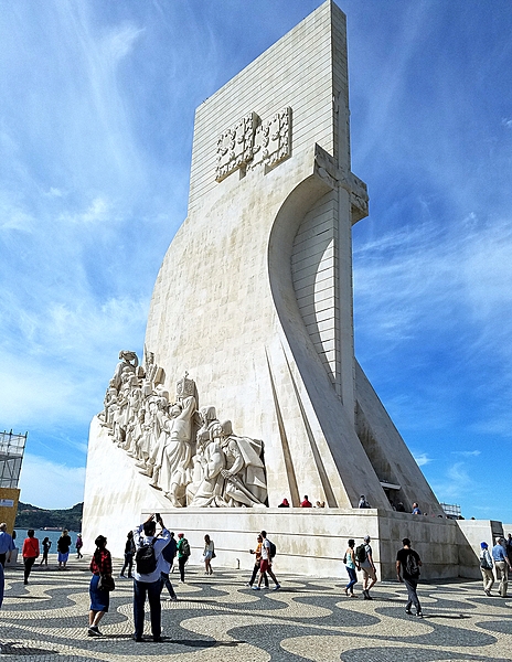 The Padrao dos descobrimentos (Monument to the Discoveries) in Lisbon, Portugal, honors monarchs, explorers, navigators, cartographers, scientists, and missionaries from the Age of Discovery (15th and 16th centuries). The main statue of Prince Henry the Navigator (1394-1460), holding a model of a carrack (a three- or four-masted sailing ship), leads a procession of 32 figures (16 on either side ramp) on the monument.