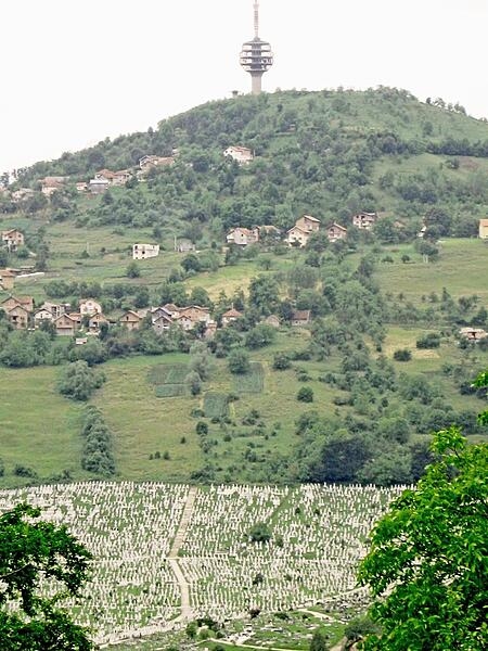 Part of Sarajevo&apos;s massive cemetery lies at the base of the hill supporting the city&apos;s communication tower.