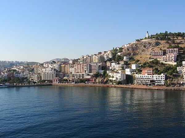 View of the port of Kusadasi, Turkey, on the Aegean Sea. The name Kusadasi means "Bird Island." In Byzantine times, it was called "Ephesus Neopolis," and the Genoese and Venetians dubbed it "Scala Nova." Turkey officially adopted its current name at the beginning of the 20th century.