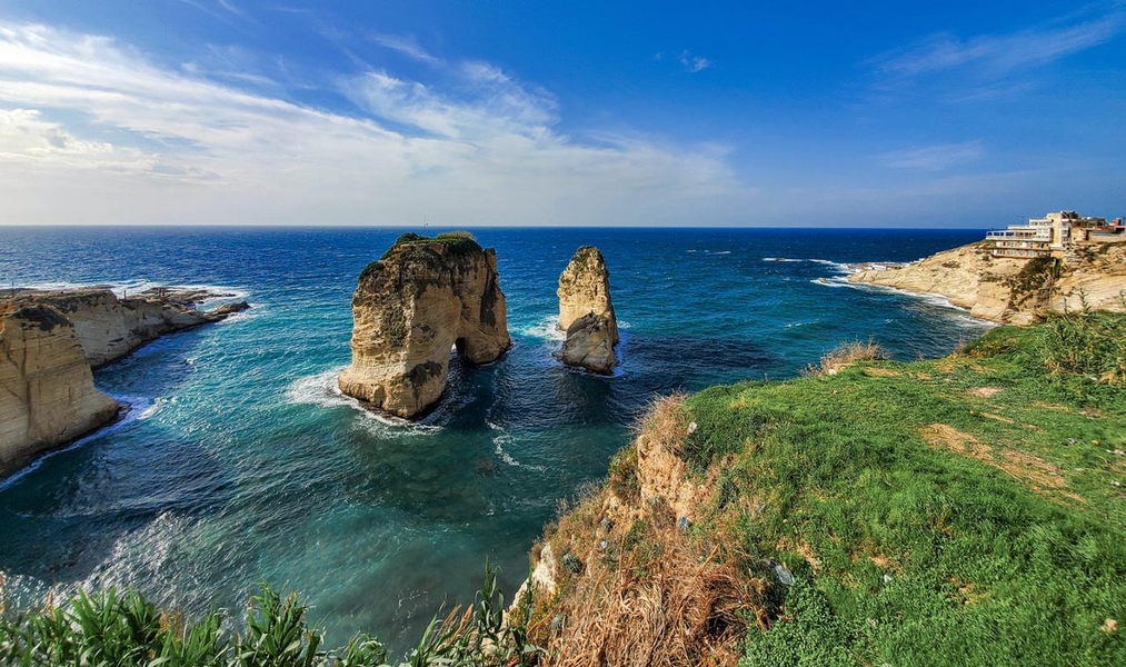 Pigeon Rocks are iconic sea stacks just offshore from Raouche, Lebanon, a residential and commercial neighborhood outside Beirut. The rocks are both approximately 60 m (196 ft) high, rising out of the Mediterranean Sea.
