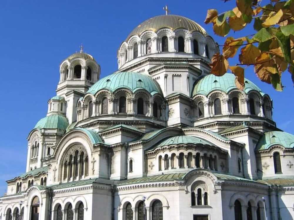 The St. Alexander Nevesky Cathedral in Sofia, Bulgaria, is one of the 50 largest Christian church buildings by volume in the world, among the 10 largest Eastern Orthodox church buildings, and the largest cathedral in the Balkans. The cathedral, built in Neo-Byzantine style, occupies an area of 3,170 square meters (34,100 sq ft) and can hold 5,000 people. Its namesake is Alexander Nevesky, a 13th-century prince, later declared a saint, who engaged in some of the toughest battles of the Kievan Rus (a Slavic tribes federation and the ancestor of today’s Russia). St. Alexander Nevesky Cathedral is dedicated to the memory of the Russian soldiers who died liberating Bulgaria from Ottoman rule during the Russo-Turkish War of 1877-1878. Construction began on the cathedral in 1882, and it was completed in 1912. The cathedral was consecrated in 1924 and declared a cultural monument in 1955.