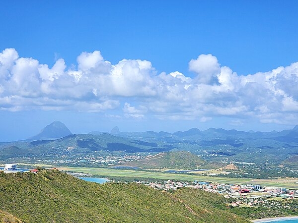 A view of Vieux Fort, the southernmost town on Saint Lucia and the site of the island's airport. The Twin Pitons, on the southwestern shore of Saint Lucia, can be seen in the distance.