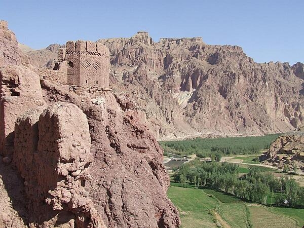 View from Shahr-i-Zohok (the "Red City") in Bamyan Province in Afghanistan. Once a citadel housing about 3,000 people, it was destroyed by the Mongols in the 13th century. The invaders also leveled the nearby city that the fortress had protected and  massacred all its inhabitants (possibly 150,000) and animals. In memory, the site is today known as Shahr-i-Gholghola (the "City of Screams").