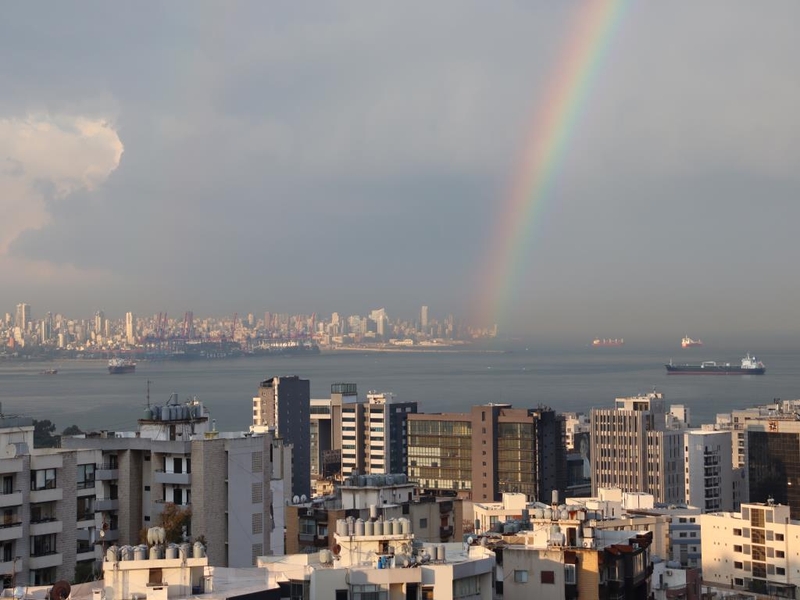 A rainbow graces the skyline of Kaslik, a town in the Keserwan District of the Keserwan-Jbeil Governorate in Lebanon. The town is a blend of old and new, with many 18th-century limestone houses and historic churches existing alongside factories and industrial plants.