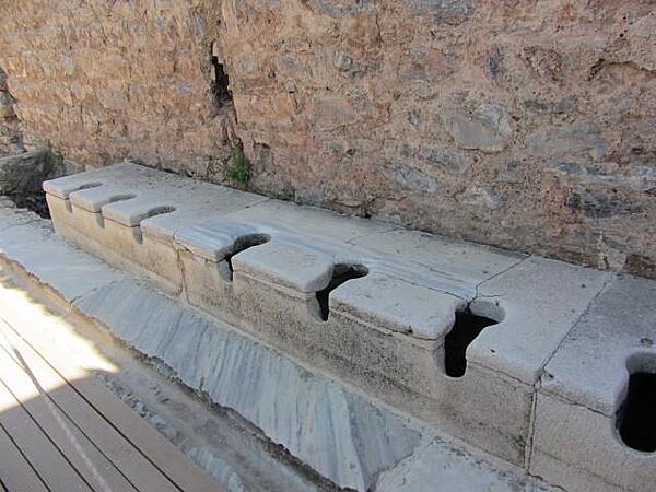 The public toilets in Ephesus, Turkey, were located in the public baths and had running water. An inscription on a wall reads: "Close your eyes, count slowly to 10, and it will come."