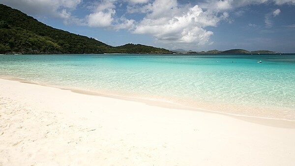 Snow white beach on Saint John in the Virgin Islands. At 50 sq km (19 sq mi), Saint John is the smallest of the three main US Virgin Islands. Photo courtesy of the US National Park Service.