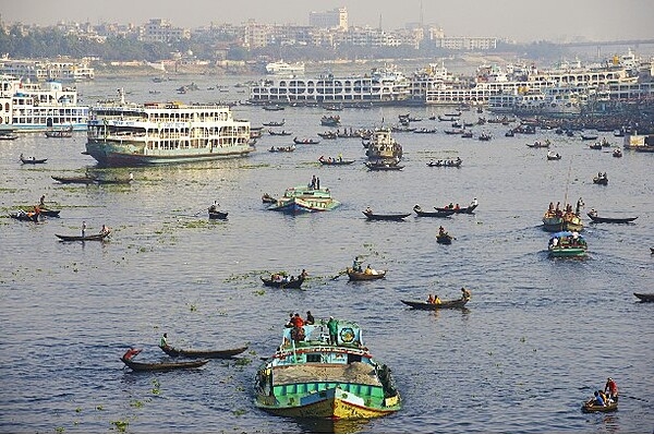 Boat traffic on the Buriganga. The Buriganga or "Old Ganges" is a river in Bangladesh that flows through the southwest outskirts of the capital city, Dhaka; its depth ranges between 7 and 18 m (23 to 59 ft). The Buriganga is economically important as a connection to other parts of Bangladesh, a largely riverine country. When the Mughals made Dhaka their capital in 1610, the banks of the Buriganga were already a prime location for trade. Today, the Buriganga river is afflicted by pollution.