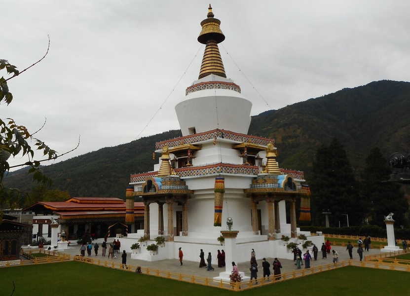 The National Memorial Chorten in Thimphu, Bhutan’s capital city, was built in 1974 in memory of Jigme Dorji Wangchuk, the popular third king of Bhutan, and is dedicated to world peace. A chorten or stupa is a mound-like structure containing relics of Buddhist monks or nuns and is used as a place of meditation. However, the National Memorial Chorten does not enshrine human remains, only a photo of the third king in ceremonial dress because he wanted to build "a chorten to represent the mind of the Buddha." The Thimpu Chorten, located in the heart of the city with its golden spires and bells, is known as the most visible religious landmark in Bhutan.