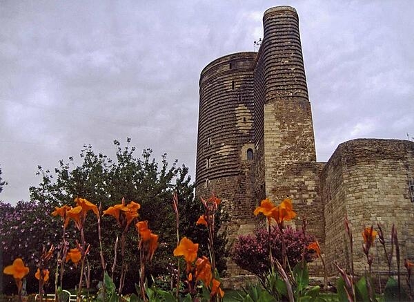 The Maiden Tower in Baku, Azerbaijan was built sometime between A.D. 800 and 1200, while the higher parts and the addition jutting out from the tower were built in around the 12th century. Standing 29 m tall (96 ft) the tower probably served as a Zoroastrian fire temple before becoming a fortification in the 12th century. The Maiden Tower houses a museum showing the history of Baku. The Tower, a UNESCO World Heritage site as part of a group of monuments, is a national emblem for Azerbaijan and appears on the country’s currency.