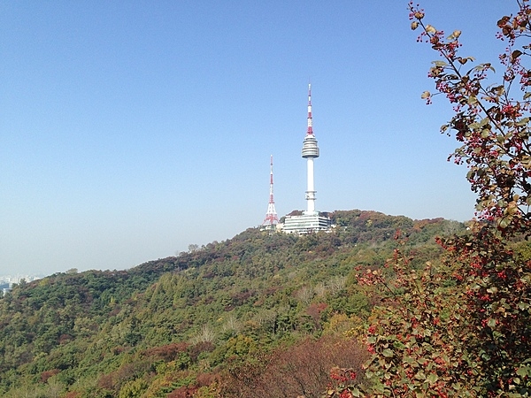 Namsan (Nam Mountain) is a 262 m (860 ft) peak overlooking Seoul, South Korea. It offers hiking, picnic areas, and views of downtown Seoul's skyline. The N Seoul Tower (236 m; 774 ft), located on top of Mt. Namsan, marks the second highest point in Seoul and serves as both a communication and observation tower.