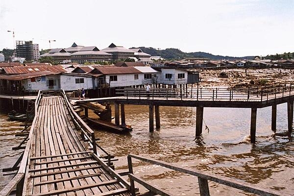 Bandar Seri Begawan is the capital and largest city of the Sultanate of Brunei. The water village of Kampong Ayer lies within its boundaries. The village, whose houses stand on stilts, stretches about 8 km (5 mi) along the Brunei River; it is a self-contained settlement equipped with schools, police stations, clinics, a waterborne fire brigade, and mosques - all connected by walkways and bridges.