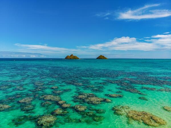The two islets off Lanakai Beach on the island of Oahu in Hawaii -- Moku Nui (left) and Moku Iki -- serve as seabird sanctuaries in the Pacific Ocean.