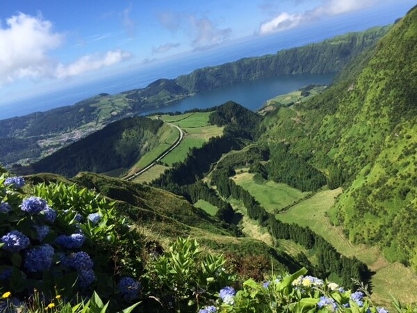 Lagoa das Sete Cidades (Lagoon of the Seven Cities) is a twin lake in the crater of a dormant volcano on the island of Sao Miguel. The Lagoa das Sete Cidades is technically one lake, but it is often referred to as two separate bodies -- Lagoa Verde (Green Lake) and Lagoa Azul (Blue Lake) -- because each side of the lake reflects sunlight in different colors.