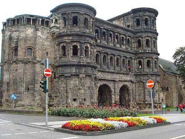 Around 16 B.C., the Romans founded Trier, Germany, which eventually became the capital of the Roman province of Gallia Belgica. It is the oldest city in Germany and the oldest seat of a Christian bishop north of the Alps. The Porta Nigra (Black Gate) in Trier was built between A.D. 186 and 200 and guarded the northern entrance to the city. After 1035, the Porta Nigra was converted into a church. During the Napoleonic Wars -- when the French occupied Trier -- Napoleon ordered that the Porta Nigra be restored to its Roman form.